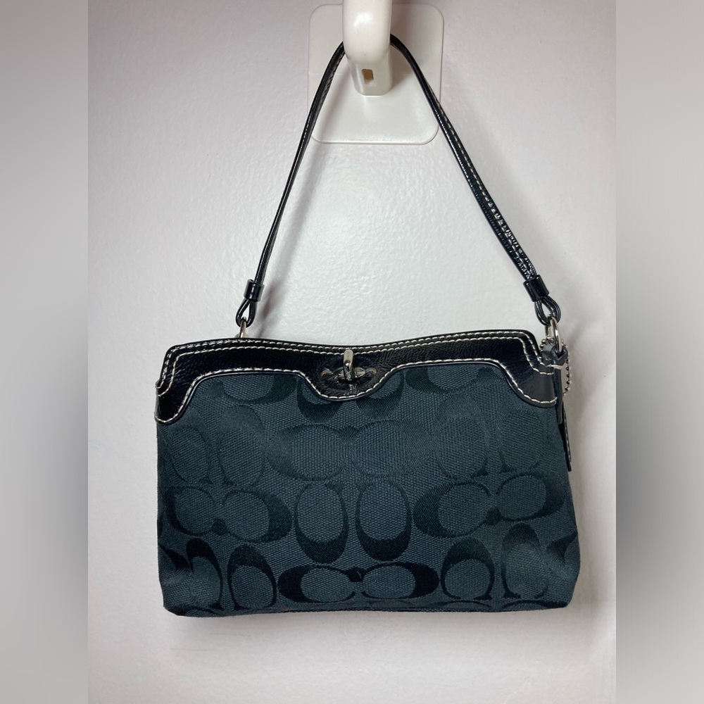 Coach wristlet with silver toggle closure